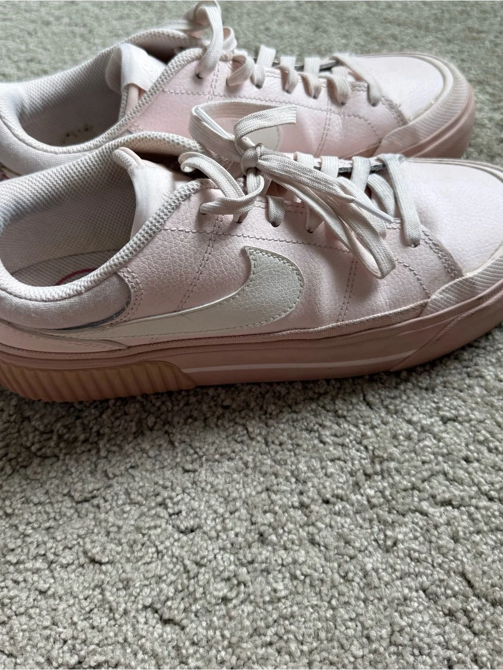 Nike Women’s Light Pink Low-Top Sneakers with White Swoosh
